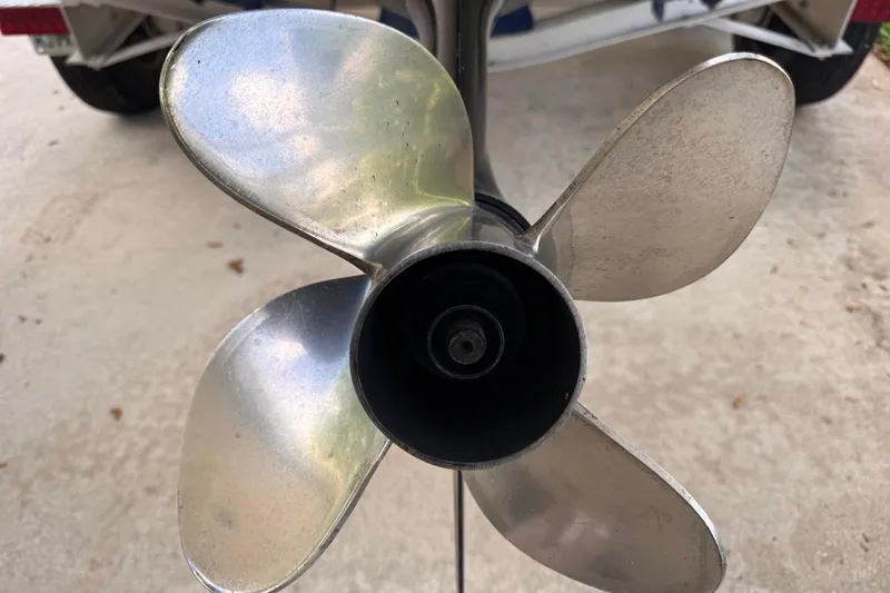 Slide: The Image of Close-up of a 2005 Storm Boats high-performance propeller on a concrete surface. - 72