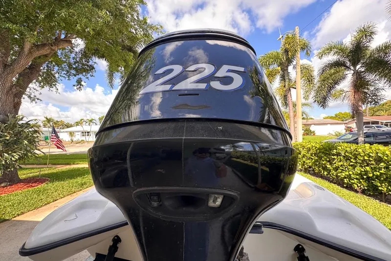 Slide: The Image of Outboard motor on 2005 Storm Boats Storm-High Performance, with "225" marking, in sunny setting. - 9