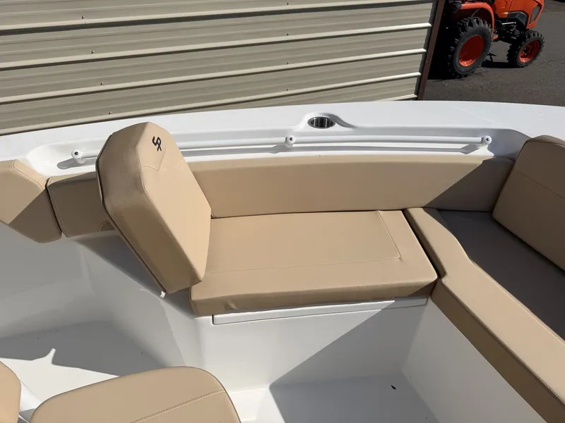 Slide: The Image of Interior view of 2026 Sea Pro 225FLX Sandbar with beige seating. - 11
