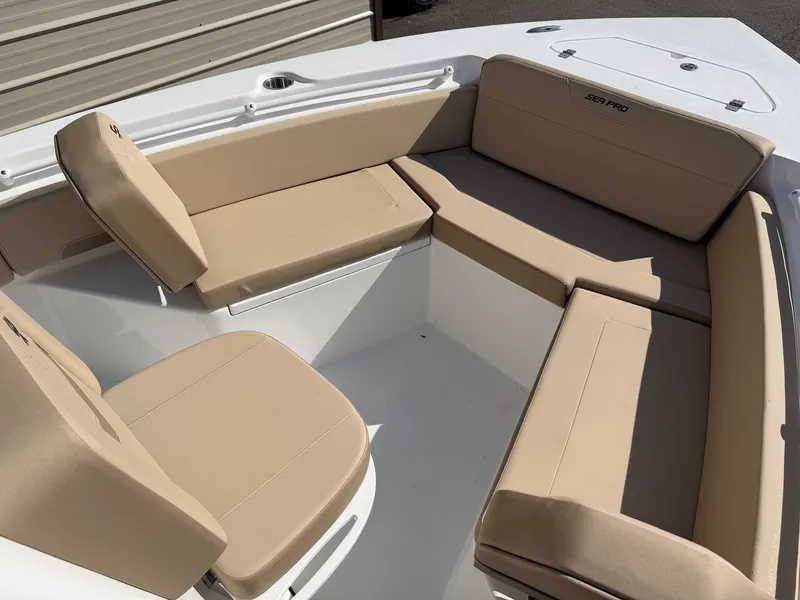 Slide: The Image of Interior view of 2026 Sea Pro 225FLX Sandbar with beige seating. - 10