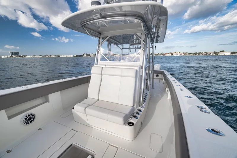 Slide: The Image of 2021 SeaVee 390Z boat on water, featuring sleek design and spacious seating. - 20