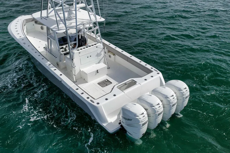 Slide: The Image of 2021 SeaVee 390Z boat with four Mercury engines on open water. - 4