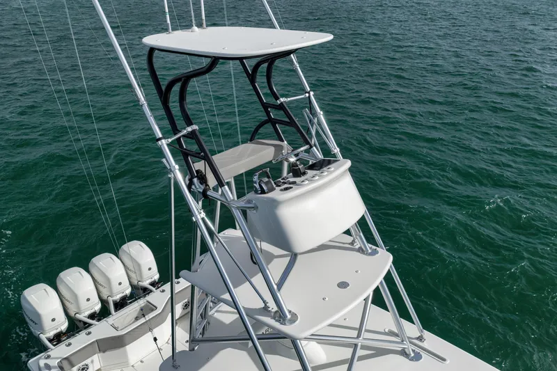 Slide: The Image of 2021 SeaVee 390Z boat with elevated helm station and multiple outboard engines on open water. - 6
