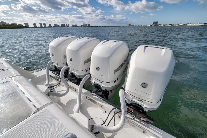 Slide: The Image of 2021 SeaVee 390Z boat with four powerful Mercury outboard engines on the water. - 9