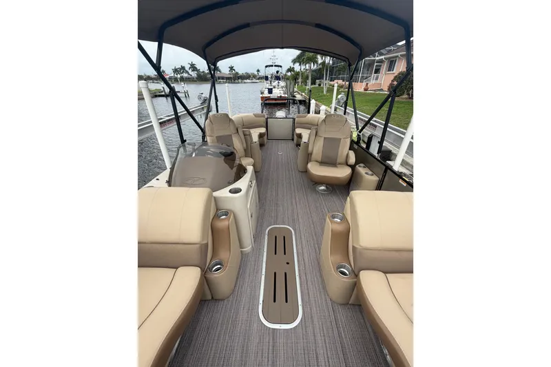 Slide: The Image of Interior view of 2020 Veranda Relax VR 22 RC pontoon boat with beige seating. - 13