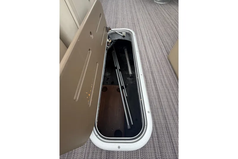 Slide: The Image of Open storage compartment on 2020 Veranda Relax VR 22 RC boat, revealing interior space. - 14