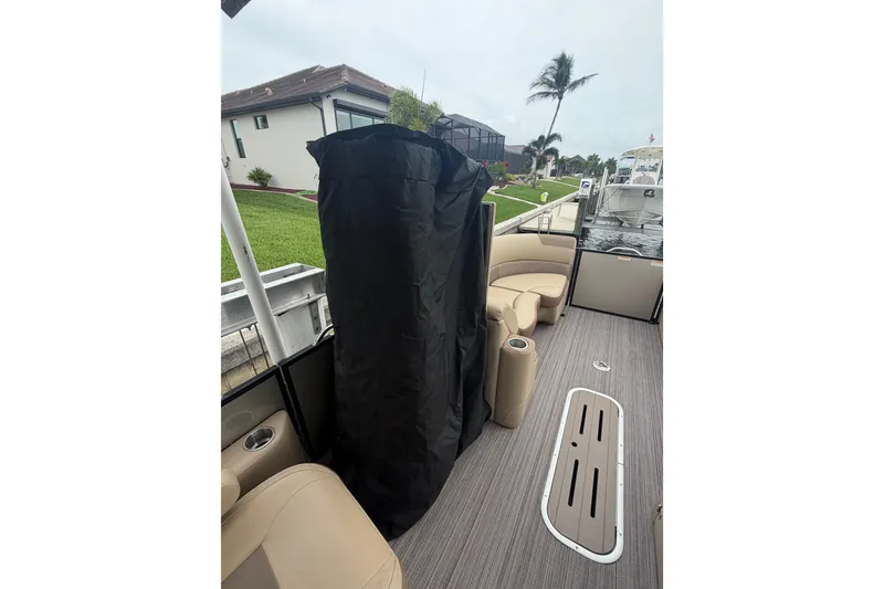 Slide: The Image of 2020 Veranda Relax VR 22 RC pontoon boat interior with seating and covered area. - 16