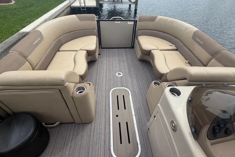 Slide: The Image of Luxurious 2020 Veranda Relax VR 22 RC pontoon boat interior with plush seating and cup holders. - 6