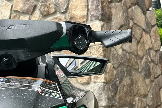Slide: The Image of Close-up of Sea-Doo PWC GTR 230, 2026 model, featuring mirror and controls. - 16