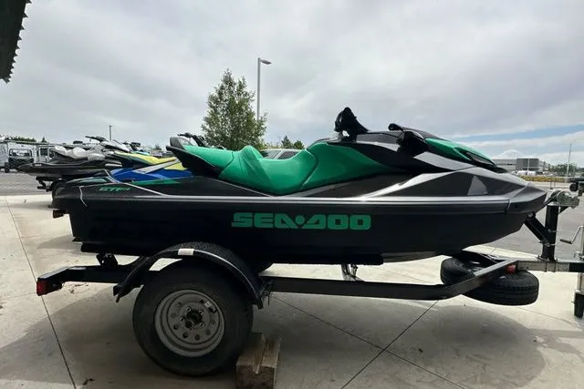 Slide: The Image of 2026 Sea-Doo PWC GTR 230 on trailer, black and green, side view. - 18