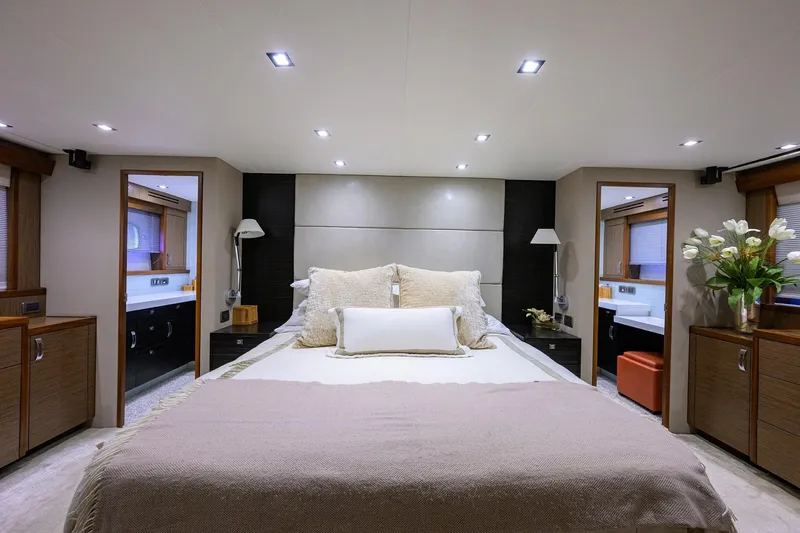 Slide: The Image of Luxurious bedroom interior of 2013 Hatteras 80 Motor Yacht with modern decor and ambient lighting. - 17