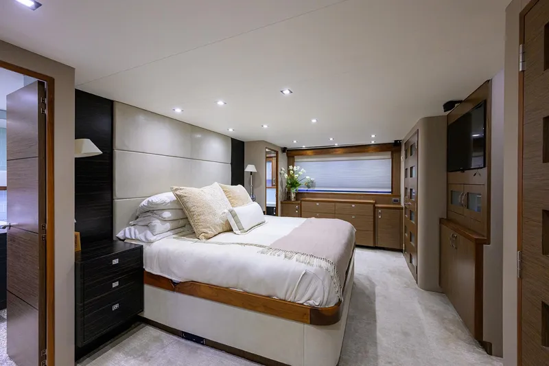 Slide: The Image of Luxurious bedroom interior of 2013 Hatteras 80 Motor Yacht with elegant furnishings. - 18
