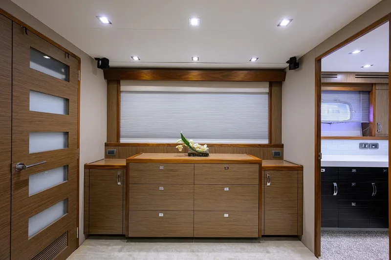 Slide: The Image of Luxurious interior of 2013 Hatteras 80 Motor Yacht with modern wood cabinetry. - 20