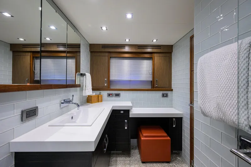 Slide: The Image of Luxurious bathroom interior of 2013 Hatteras 80 Motor Yacht with modern fixtures and elegant design. - 22