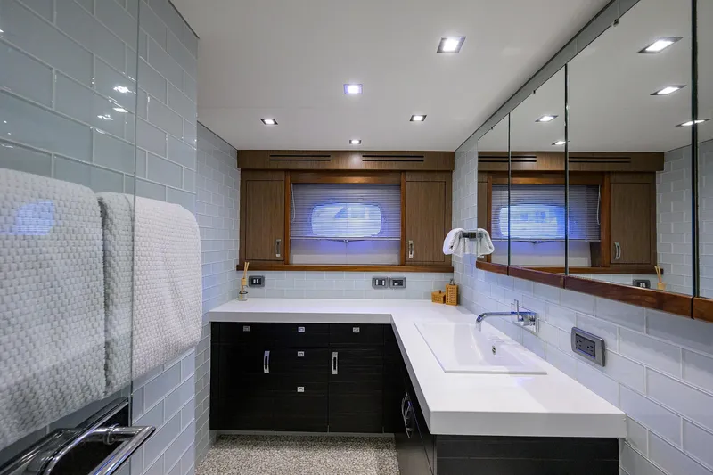 Slide: The Image of Luxurious bathroom interior on 2013 Hatteras 80 Motor Yacht with modern fixtures and elegant design. - 23