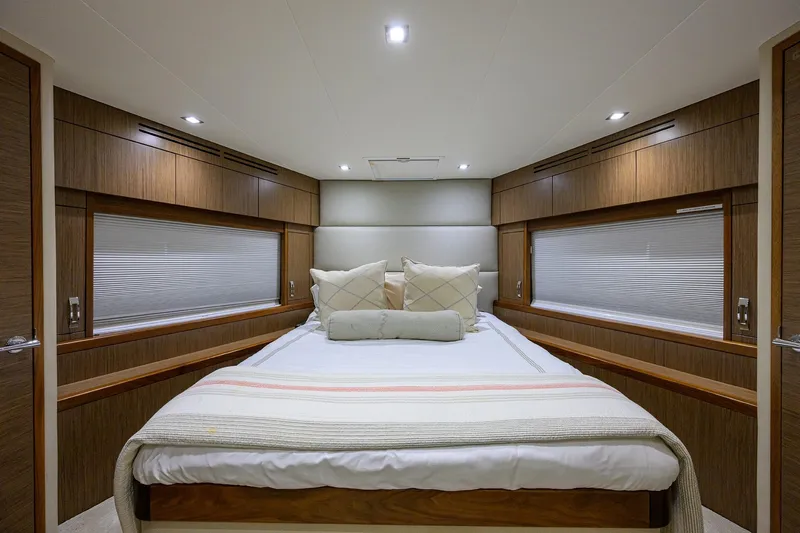 Slide: The Image of Luxurious bedroom interior of 2013 Hatteras 80 Motor Yacht with elegant wood paneling. - 26