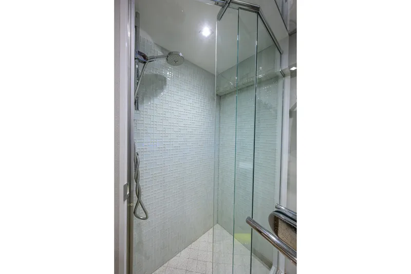 Slide: The Image of Modern glass shower in 2013 Hatteras 80 Motor Yacht bathroom. - 29