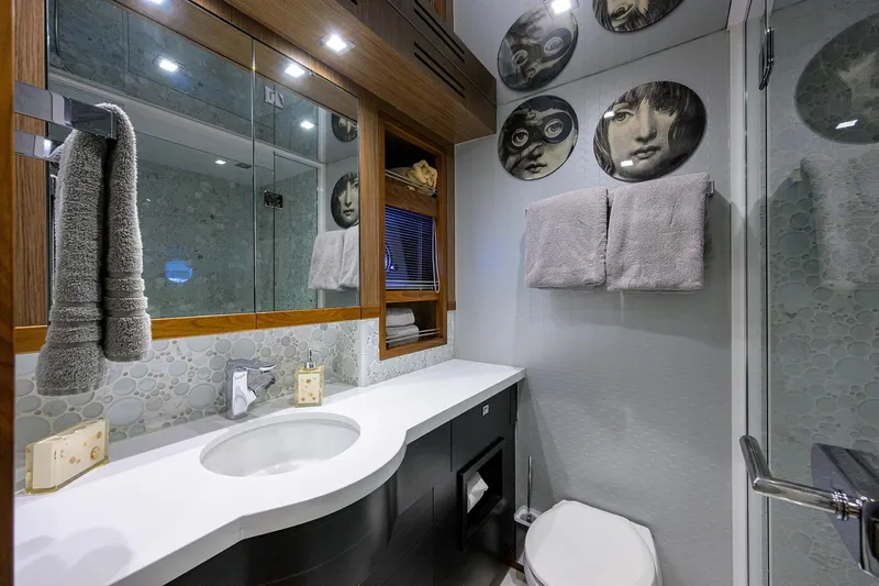 Slide: The Image of Luxurious bathroom on 2013 Hatteras 80 Motor Yacht with modern decor and elegant fixtures. - 34
