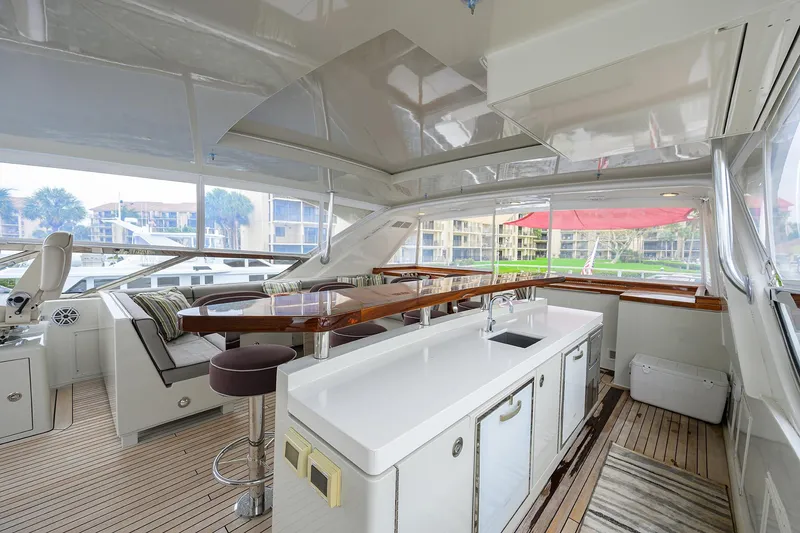 Slide: The Image of Luxurious 2013 Hatteras 80 Motor Yacht interior with sleek kitchen and seating area. - 39