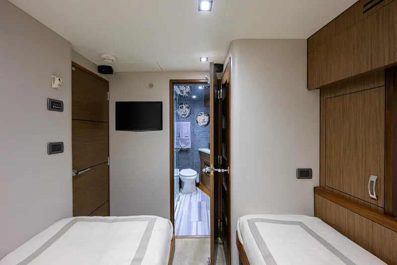 Slide: The Image of Interior of 2013 Hatteras 80 Motor Yacht cabin with twin beds and bathroom. - 40