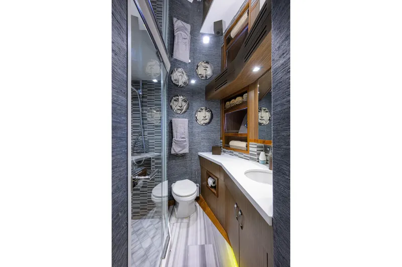 Slide: The Image of Luxurious bathroom on 2013 Hatteras 80 Motor Yacht with modern decor and elegant fixtures. - 41