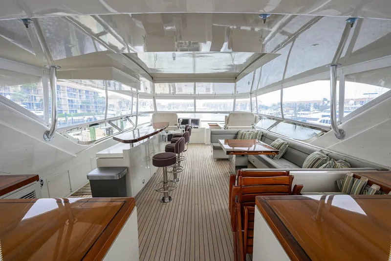Slide: The Image of Luxurious interior of 2013 Hatteras 80 Motor Yacht with seating and bar area. - 46