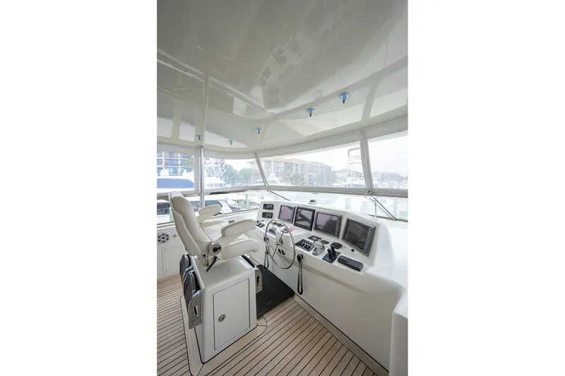 Slide: The Image of Helm of 2013 Hatteras 80 Motor Yacht with modern navigation equipment. - 51