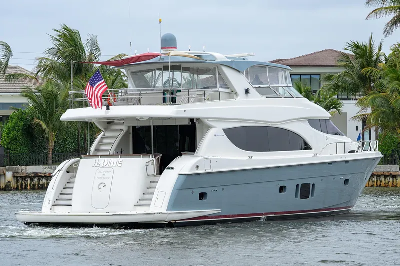 Slide: The Image of 2013 Hatteras 80 Motor Yacht cruising near waterfront homes. - 53