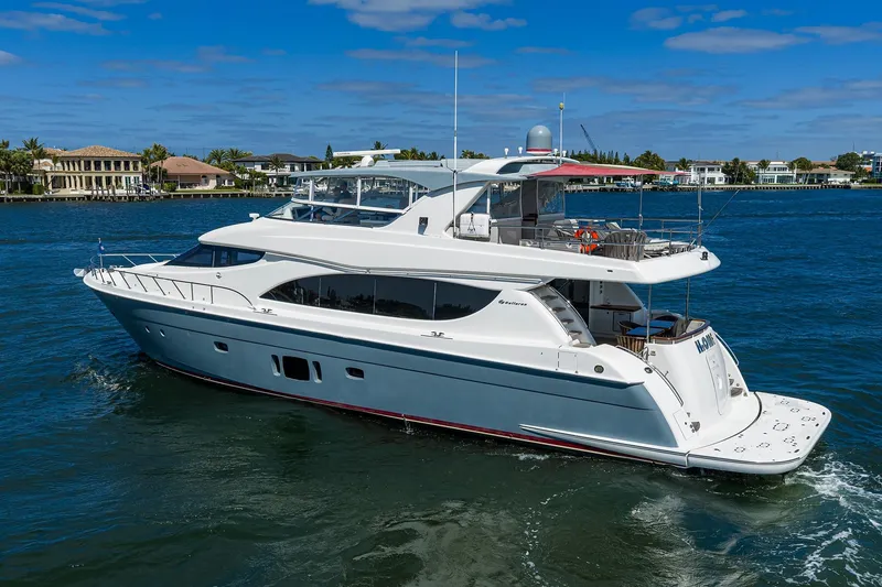 Slide: The Image of 2013 Hatteras 80 Motor Yacht cruising on a sunny day, showcasing luxury and elegance. - 65