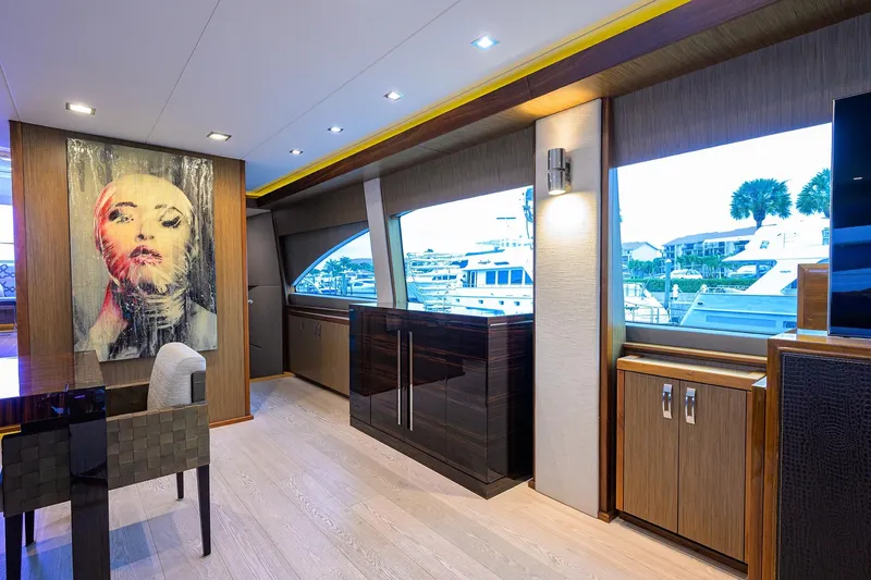 Slide: The Image of Luxurious interior of 2013 Hatteras 80 Motor Yacht with modern art and large windows. - 7
