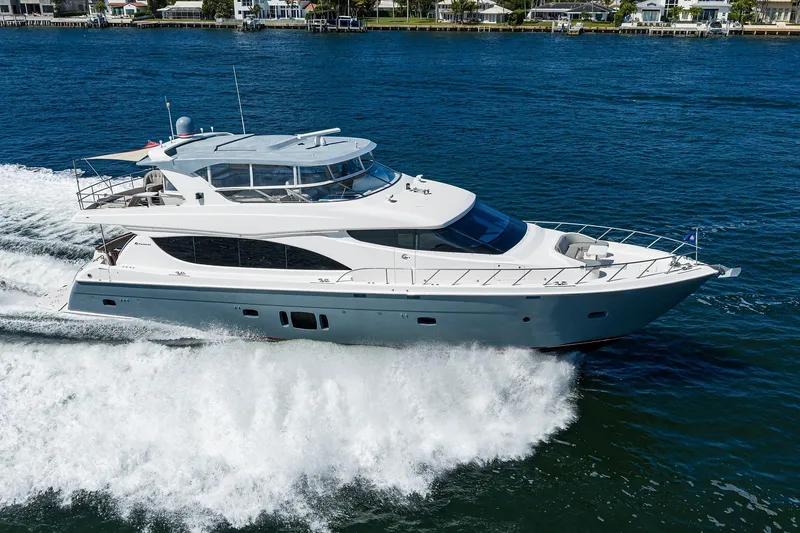 Slide: The Image of 2013 Hatteras 80 Motor Yacht cruising on blue water, showcasing sleek design and luxury. - 71
