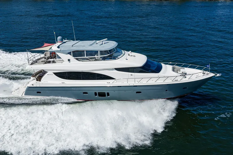 Slide: The Image of 2013 Hatteras 80 Motor Yacht cruising on open water. - 72