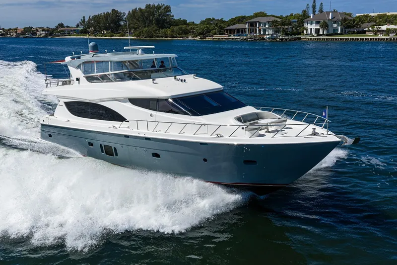 Slide: The Image of 2013 Hatteras 80 Motor Yacht cruising on open water. - 73