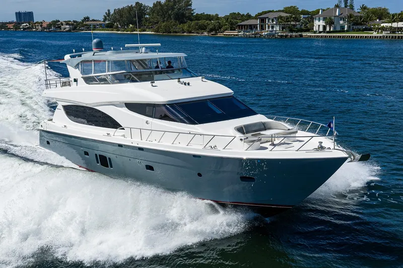 Slide: The Image of 2013 Hatteras 80 Motor Yacht cruising on a sunny day, surrounded by blue water. - 74