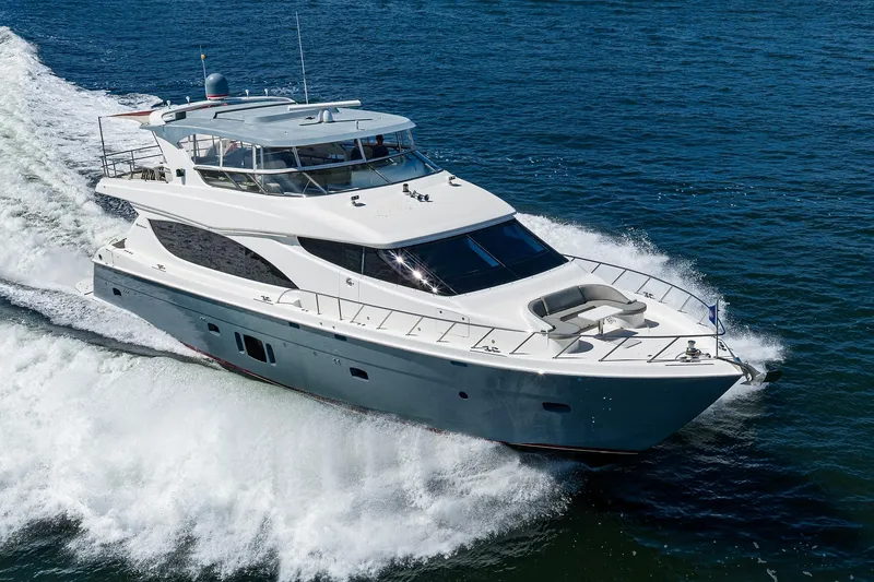 Slide: The Image of Luxurious 2013 Hatteras 80 Motor Yacht cruising on open water. - 75