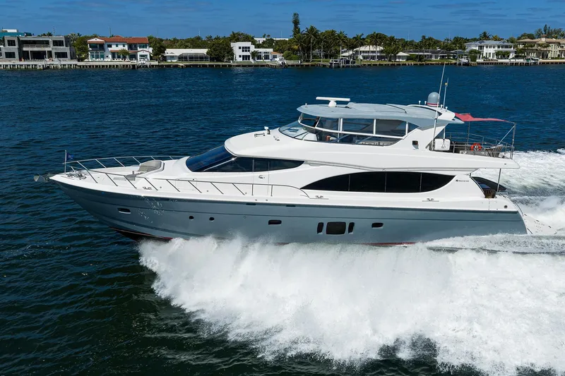 Slide: The Image of 2013 Hatteras 80 Motor Yacht cruising on open water, luxury vessel in motion. - 81