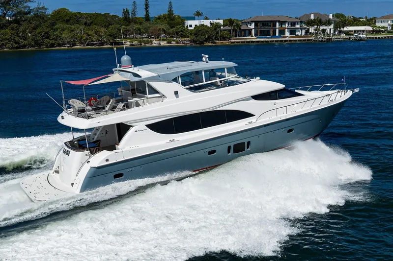 Slide: The Image of 2013 Hatteras 80 Motor Yacht cruising on blue water, luxury vessel. - 84