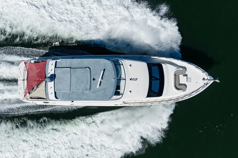 Slide: The Image of Overhead view of 2013 Hatteras 80 Motor Yacht cruising on water. - 86
