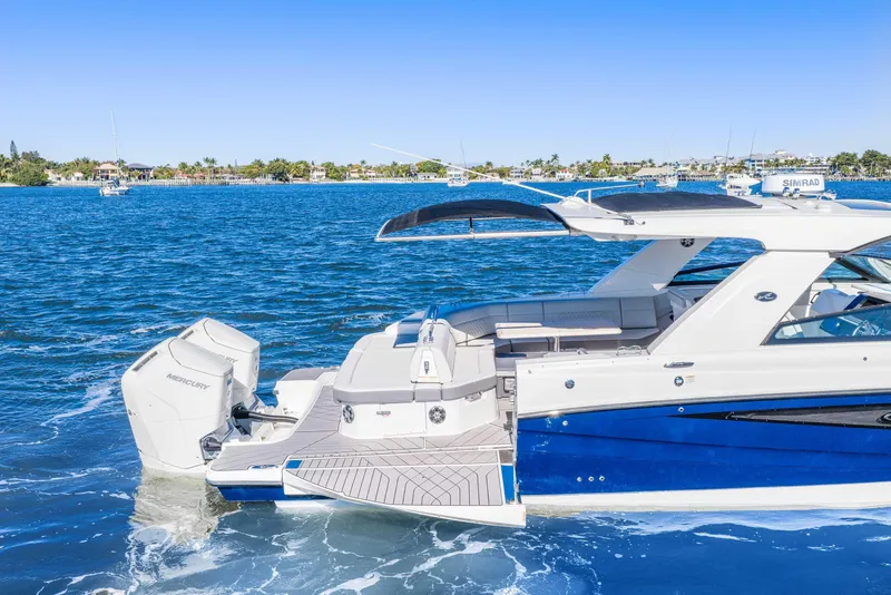 Slide: The Image of 2023 Sea Ray SLX 400 Outboard cruising on a sunny day, showcasing luxury and performance. - 21