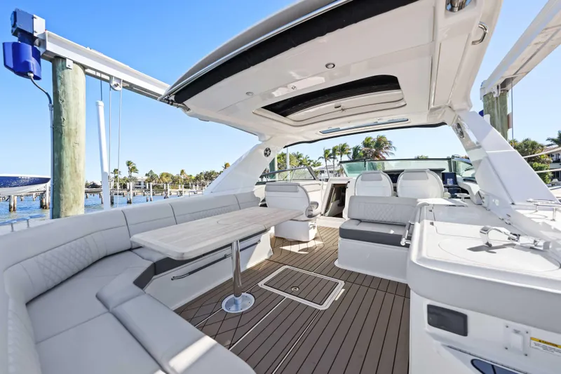 Slide: The Image of 2023 Sea Ray SLX 400 Outboard luxury boat interior with spacious seating and elegant design. - 22