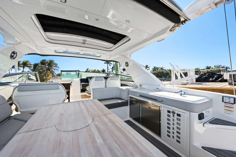 Slide: The Image of Luxurious 2023 Sea Ray SLX 400 Outboard interior with sleek seating and modern amenities. - 29