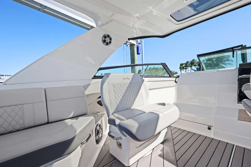 Slide: The Image of 2023 Sea Ray SLX 400 Outboard interior with luxurious seating and modern design. - 32