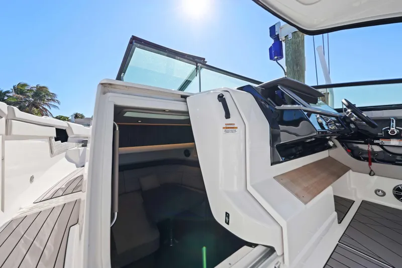 Slide: The Image of 2023 Sea Ray SLX 400 Outboard cockpit with open cabin and modern helm. - 38