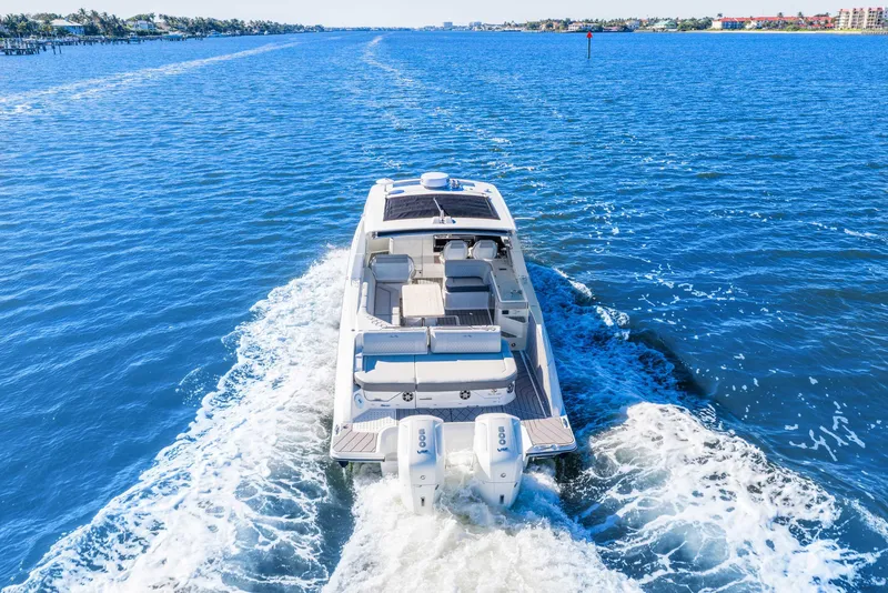 Slide: The Image of 2023 Sea Ray SLX 400 Outboard cruising on open blue water. - 8