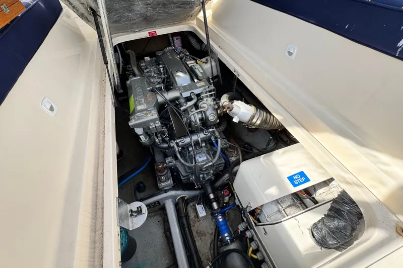 Slide: The Image of Engine compartment of a 2004 Mainship Pilot 30 Rum Runner boat. - 26