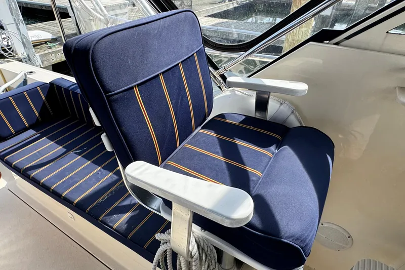 Slide: The Image of Blue-striped seating on 2004 Mainship Pilot 30 Rum Runner boat. - 33
