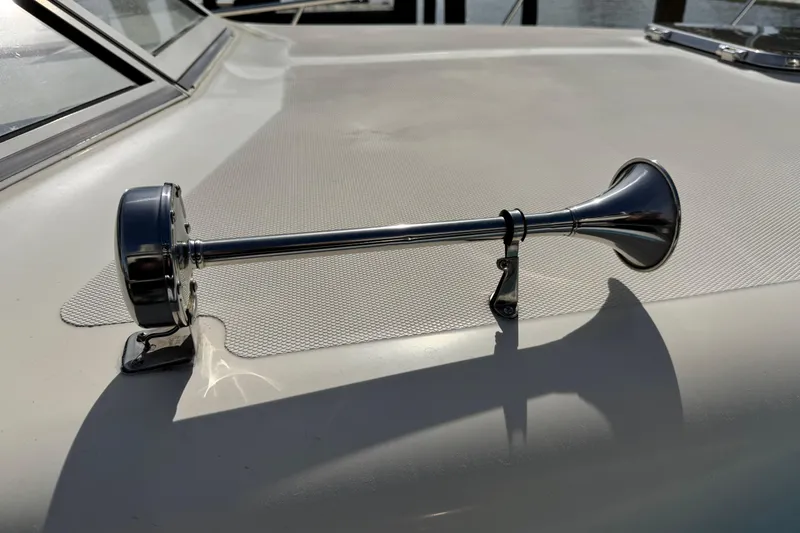Slide: The Image of Chrome horn on 2004 Mainship Pilot 30 Rum Runner boat deck. - 56