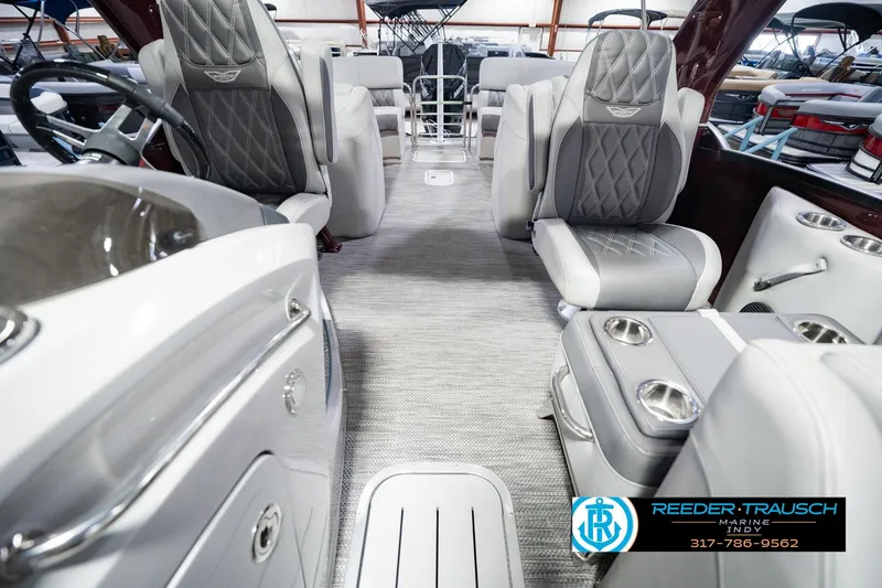 Slide: The Image of Interior of a 2022 Bennington 23 QXFBA boat with luxurious seating and modern design. - 18