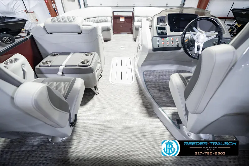 Slide: The Image of Interior of a 2022 Bennington 23 QXFBA boat with luxurious seating and modern dashboard. - 22