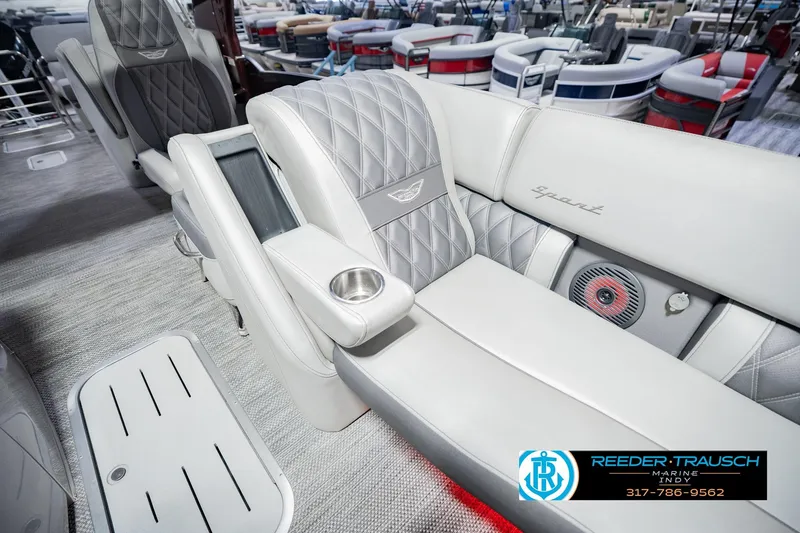 Slide: The Image of Luxurious interior of 2022 Bennington 23 QXFBA pontoon boat with plush seating and cup holder. - 28